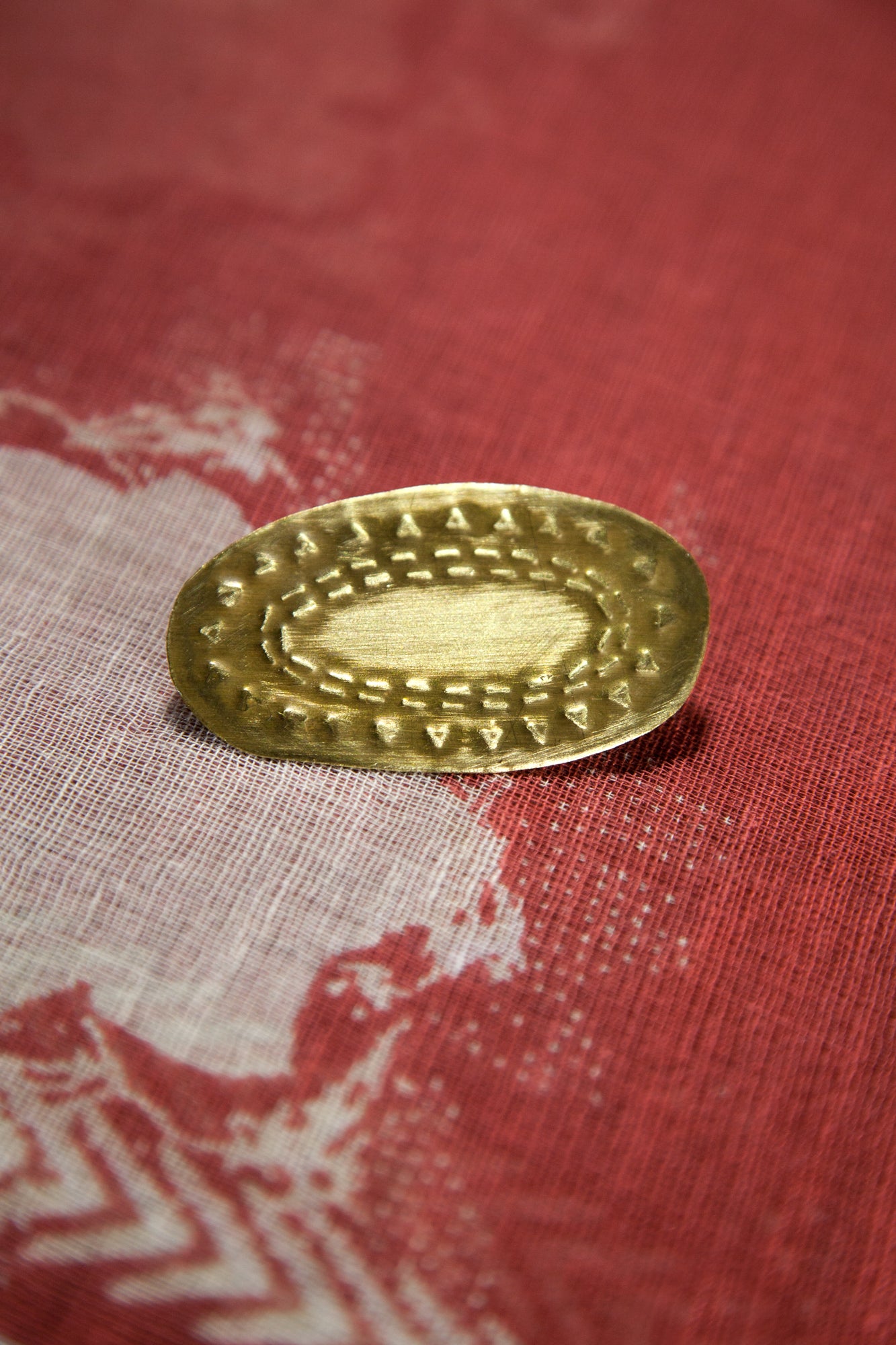 Tribal oval brooch